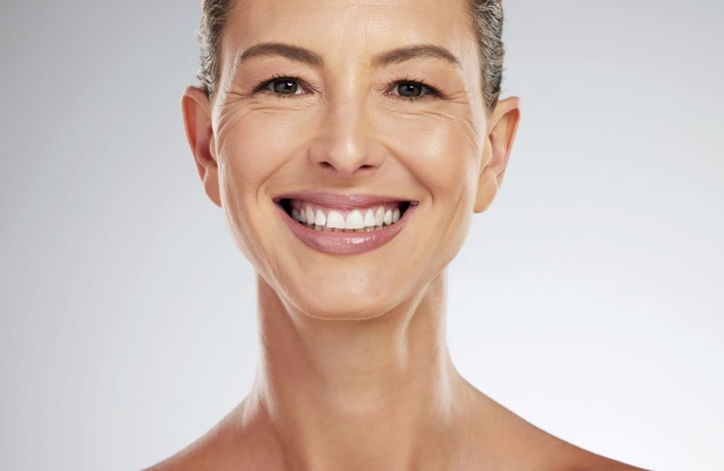 Female lower face and neck prior to RF microneedling procedure for skin texture and tightening