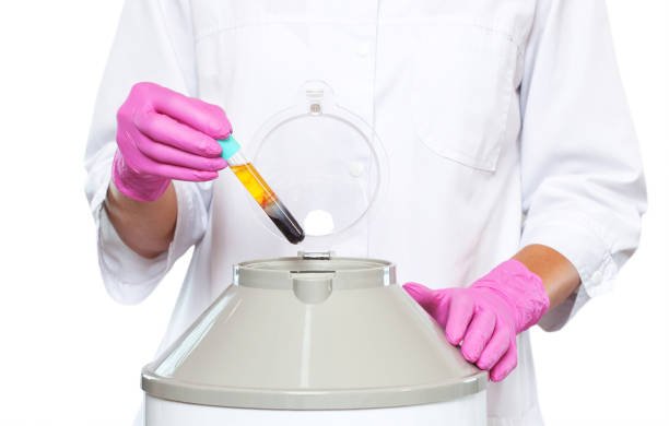 Cosmetologist does prp therapy on the face of a beautiful woman in a beauty salon. There is in vitro  blood plasma, ready for injection. Cosmetology concept.